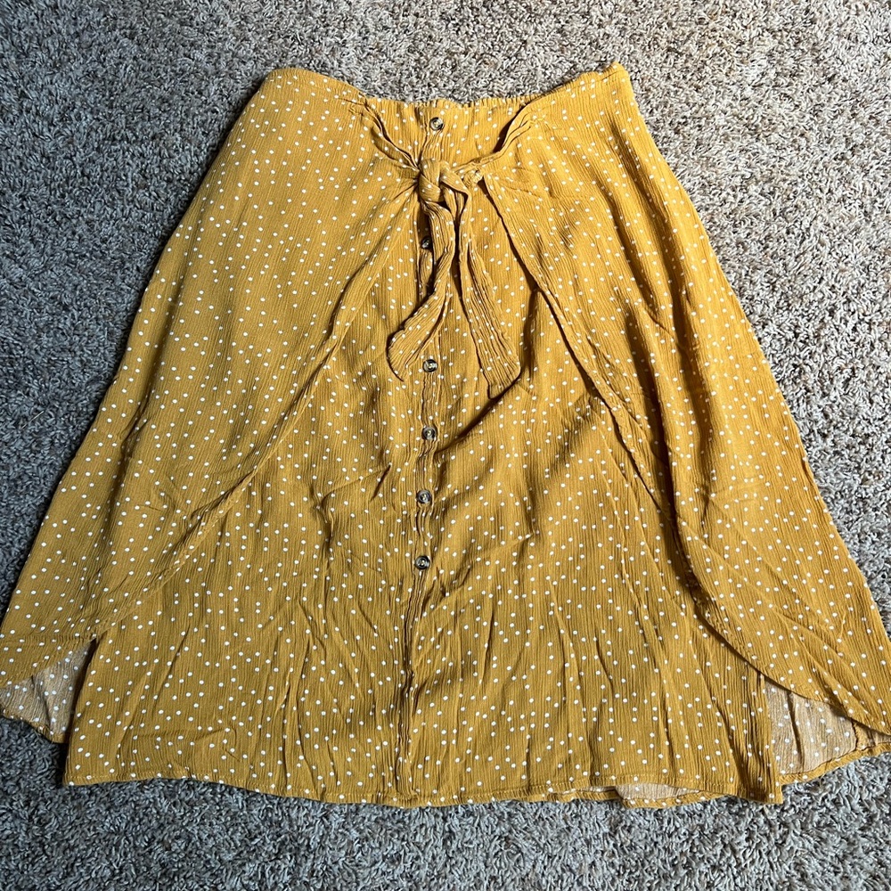 Mustard skirt, ties in the front with buttons zipper on the side size large